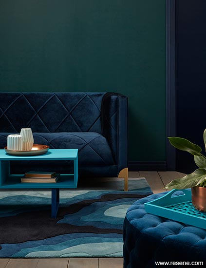 A dark and dramatic aqua and blue lounge