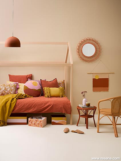 A trendy teen's bedroom using softer rosier shades of pink