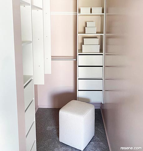 A pink and white wardrobe interior