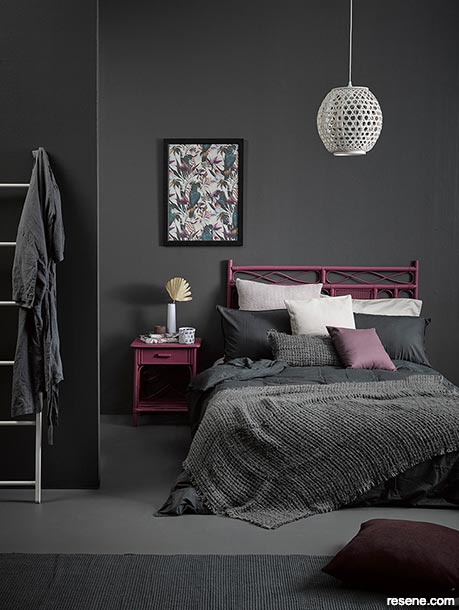 A relaxing bedroom painted in dark colours