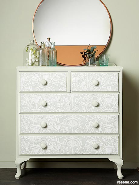 Using wallpaper to decorate a set of drawers
