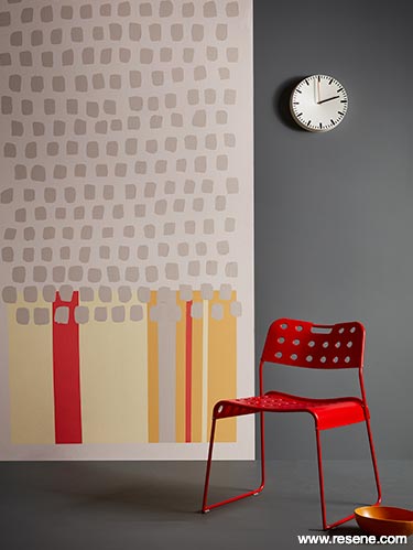 Focus on grey with a pop of red - graphic mural with red chair