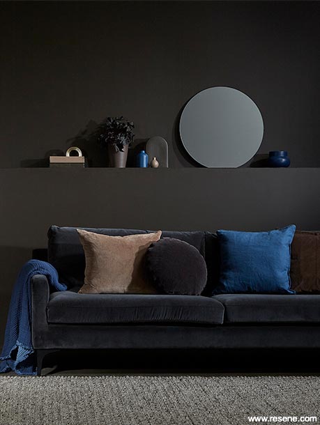 A tonal brown lounge with blue accessories
