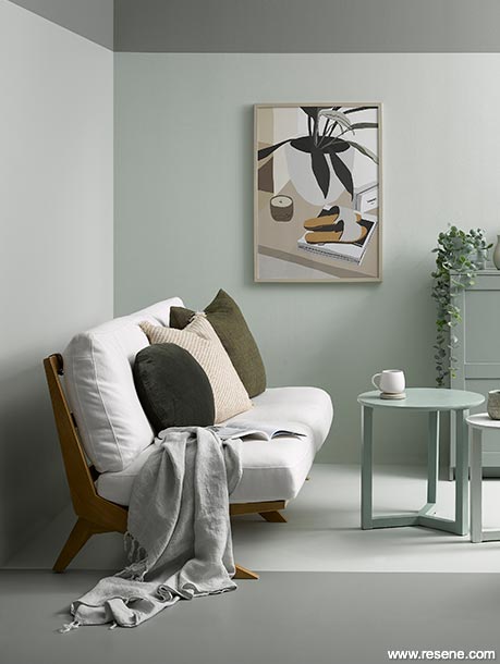 A green and grey lounge with brown accessories