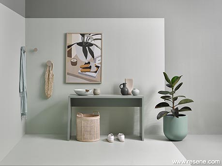 A green grey room with console table
