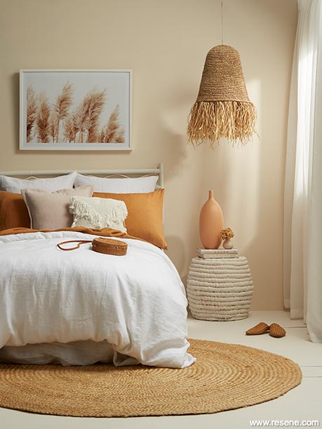 A bedroom with soft and warming neutrals