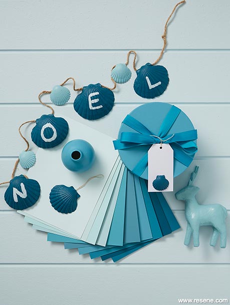 A blue beach Christmas themed moodboard