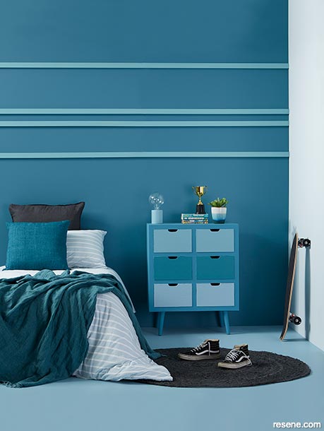 A deep blue teen bedroom