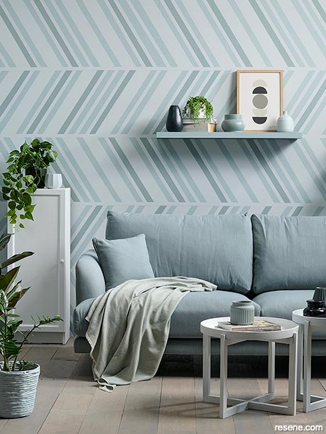 A tonal blue lounge with a painted herringbone design