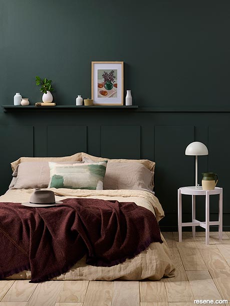 A dark forest green bedroom