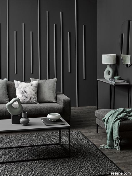 A luxurious soft black lounge with green accents