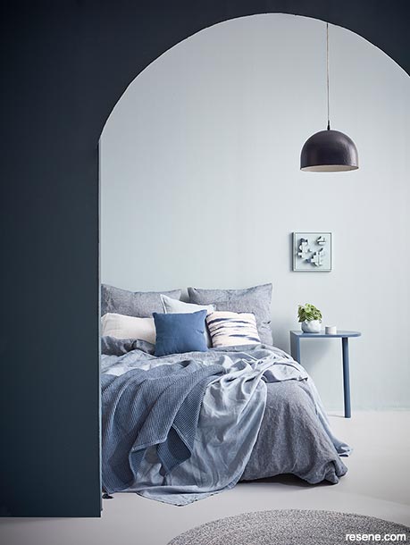 Bedroom in blues with a contrasting archway in Resene Avalanche