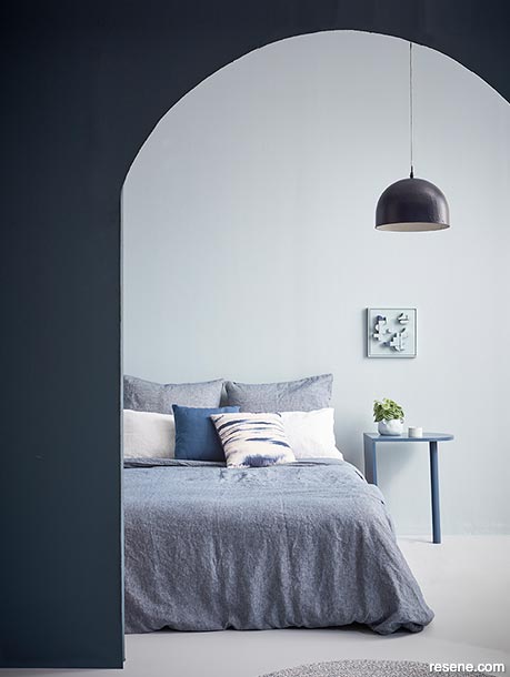A casual yet sophisticated blue bedroom