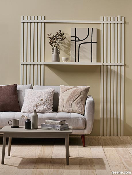 A lounge with a panelled wall