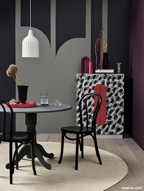 A purple and black dining room