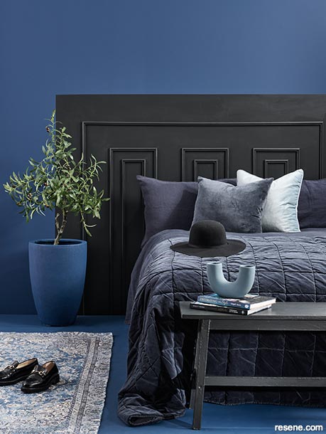 A blue and black bedroom 