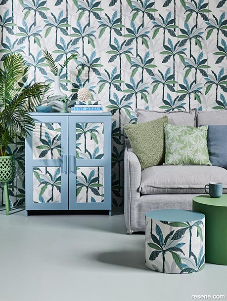 A wallpapered tropical themed lounge