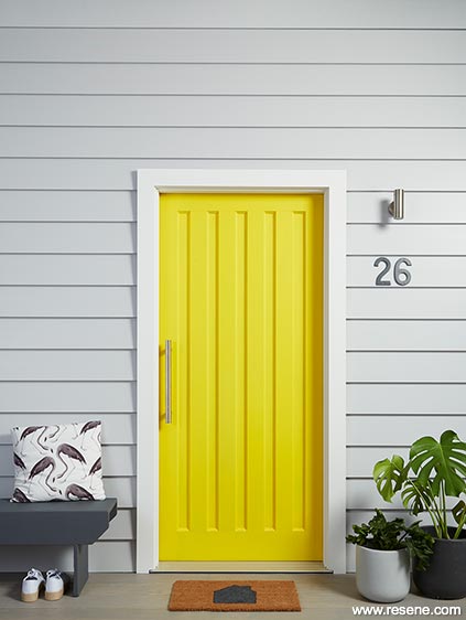 A bright yellow entry door