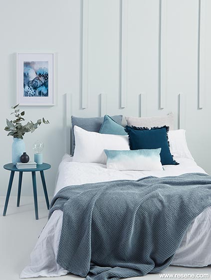 A bright and breezy pale blue bedroom