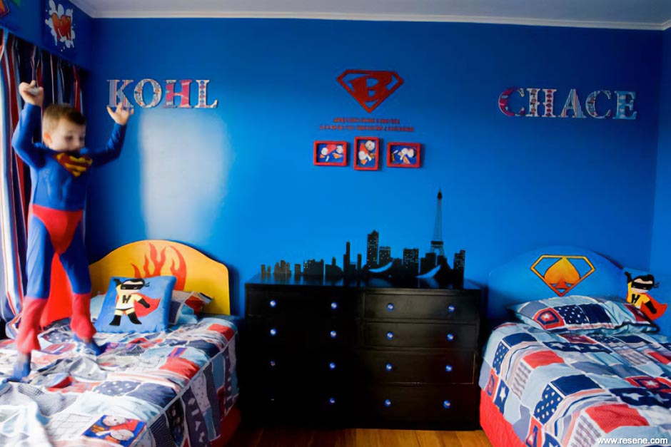 A blue superhero themed bedroom