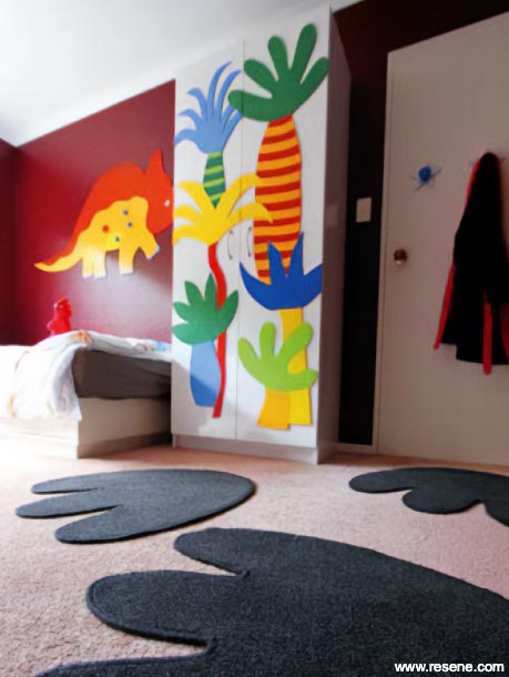 Kids bedroom with dinosaur footprints on floor