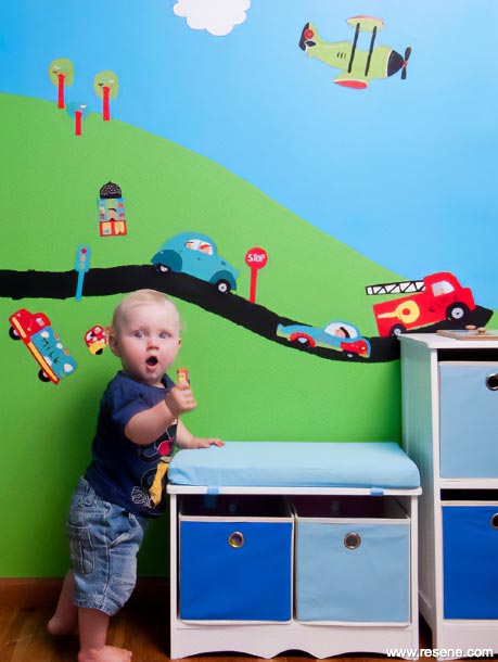 A kid's mural featuring planes and cars