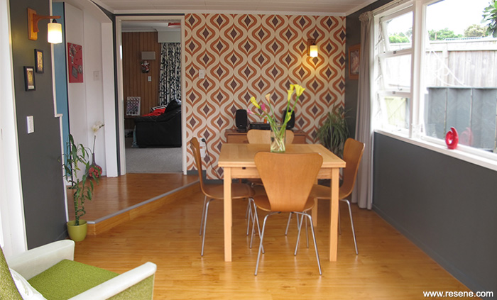 The dining room features Resene Gravel with a retro wallpape
