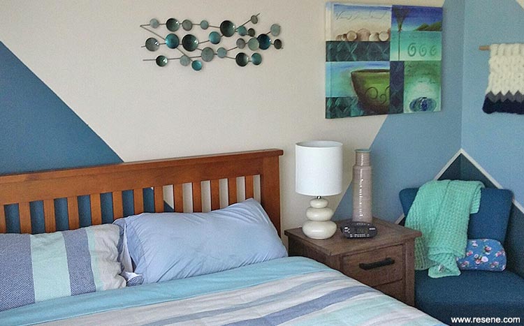 the bedroom painted in three shades of pacific colours