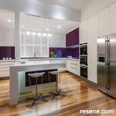 A white kitchen with colourful detailing.