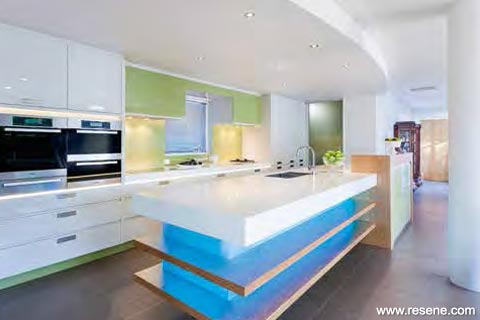 white kitchen with blue and green.
