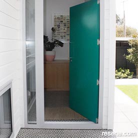 Teal and white home entrance