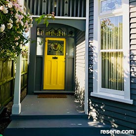 Yellow, black, and white home entrance