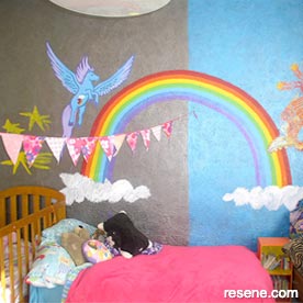 Girls' room with rainbow mural