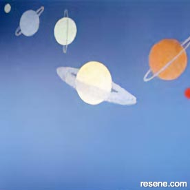 Child's bedroom with planet mural