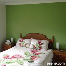 Green feature wall in bedroom