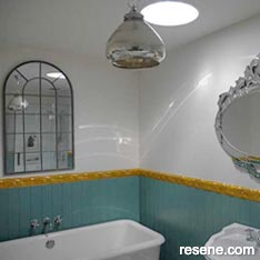 Green, white, and gold bathroom