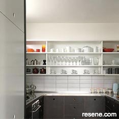 Colourful kitchen with dark cupboards