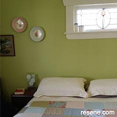 Green and white master bedroom