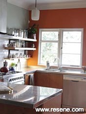 Orange kitchen with white tiles