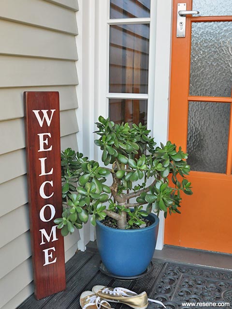 Paint a welcome sign for your front door entryway