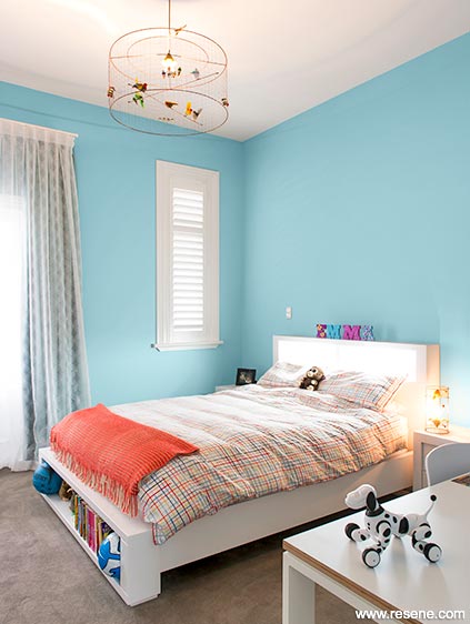 A pale blue/teal bedroom