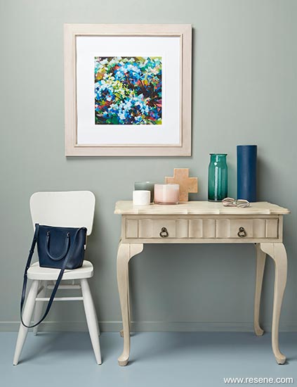 Hallway table and frame in wax finish with pastel walls and floors