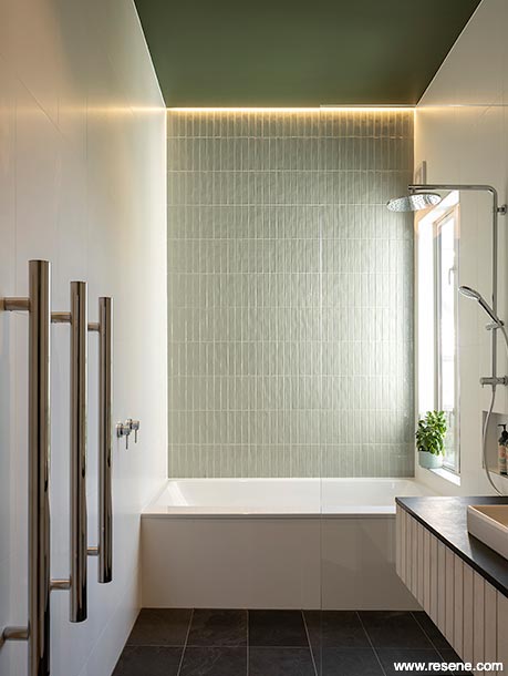 Green and white tiled bathroom