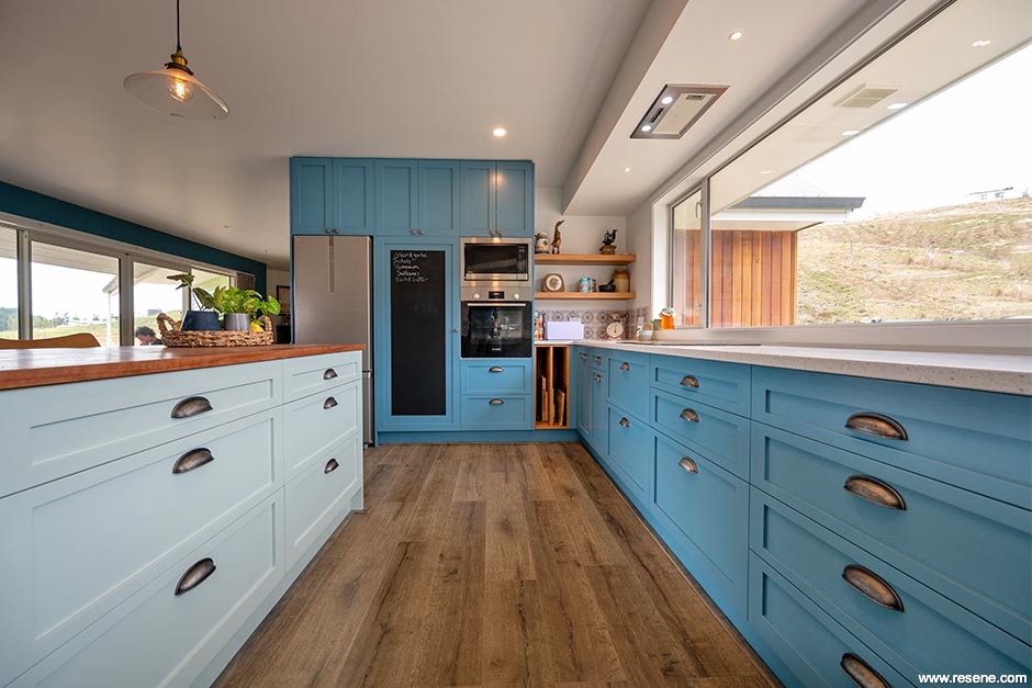 A light blue and green kitchen