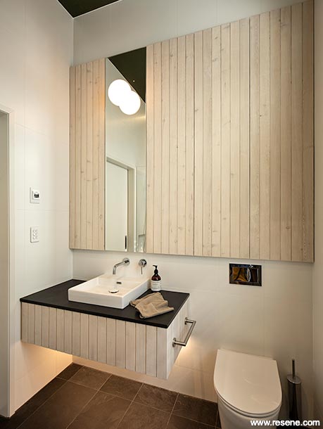 Whitewashed timber panelling in a bathroom
