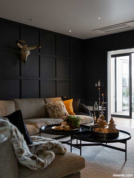 A black board and batten wall in Resene Nocturnal gives a cosy feel