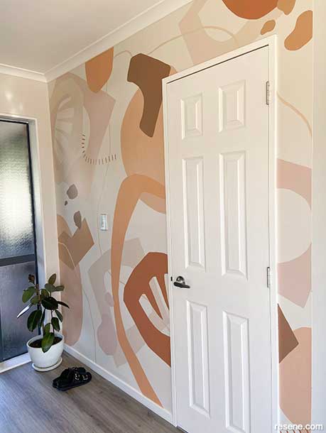 Layering paler and deeper shades in an entranceway mural