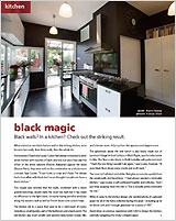 A striking black walled kitchen
