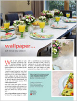 A shimmery floral-style relief pattern wallpaer is part of a creative table setting