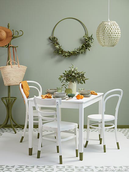 Fresh green dining room with a stencilled floor
